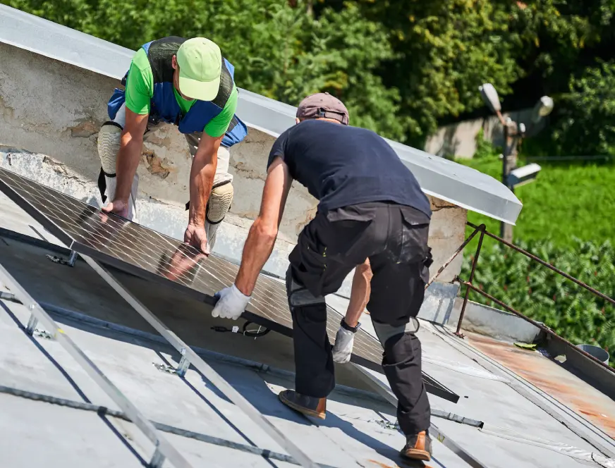 workers-building-solar-panel-system-on-roof-of-hou-2024-01-24-17-44-49-utc.webp